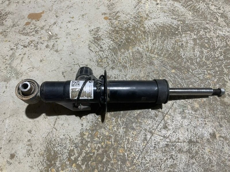 Амортизатор задний левый