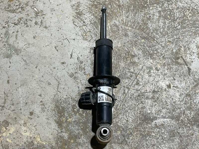 Амортизатор задний левый