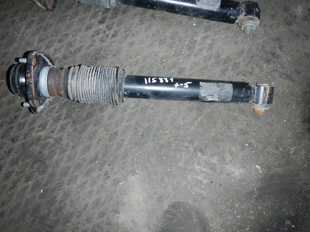 Амортизатор задний левый