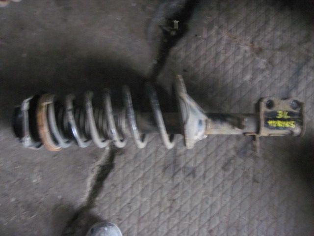 Амортизатор задний левый