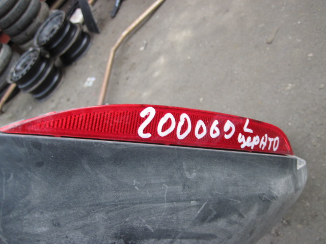 Отражатель в бампер задний левый