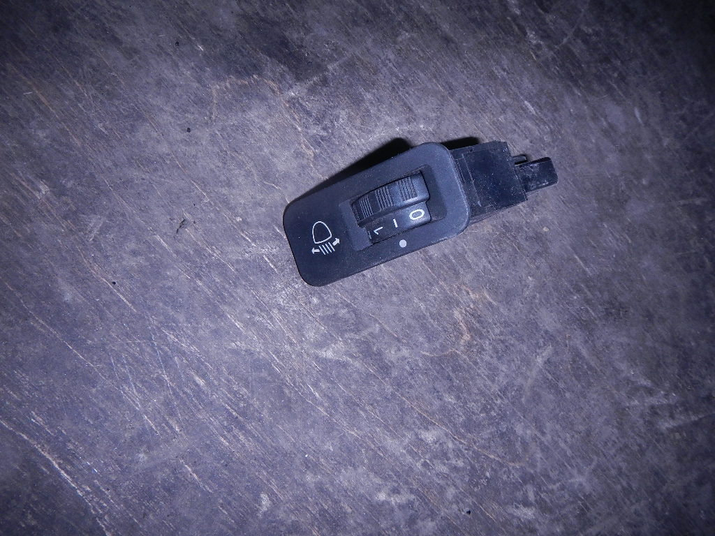 Кнопка корректора фар