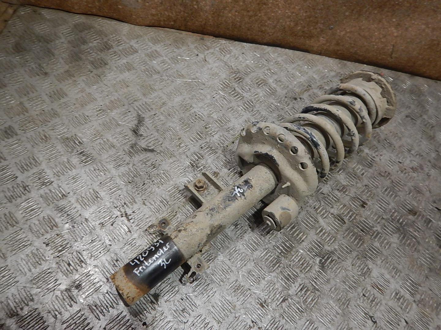 Амортизатор задний левый