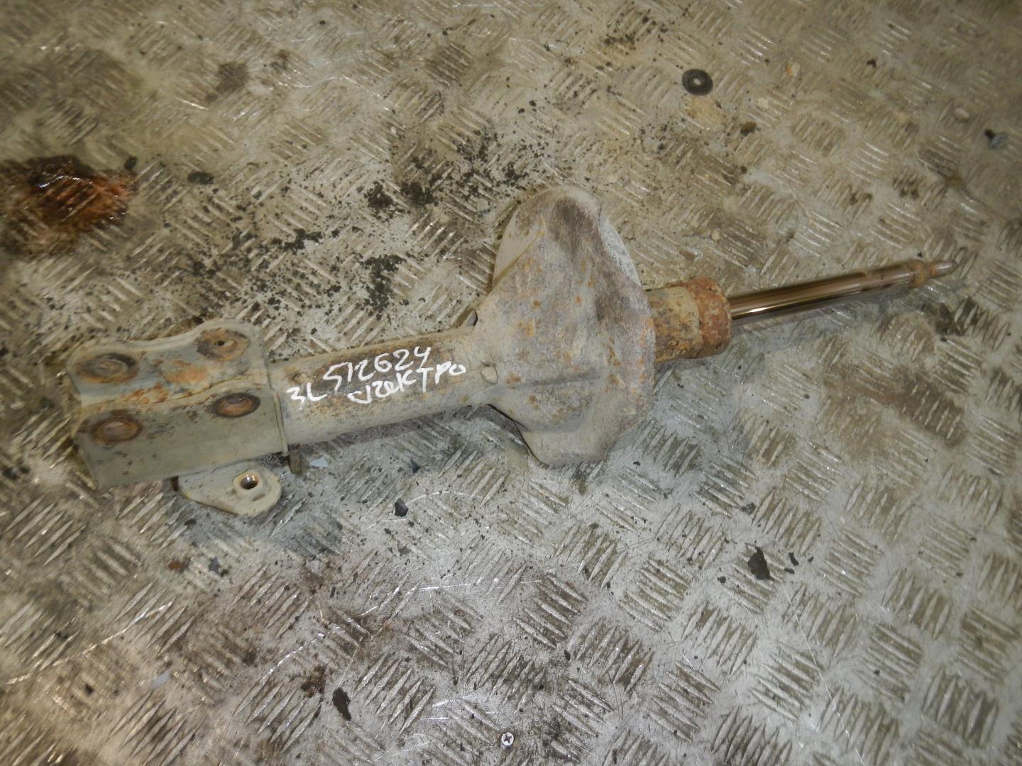 Амортизатор задний левый