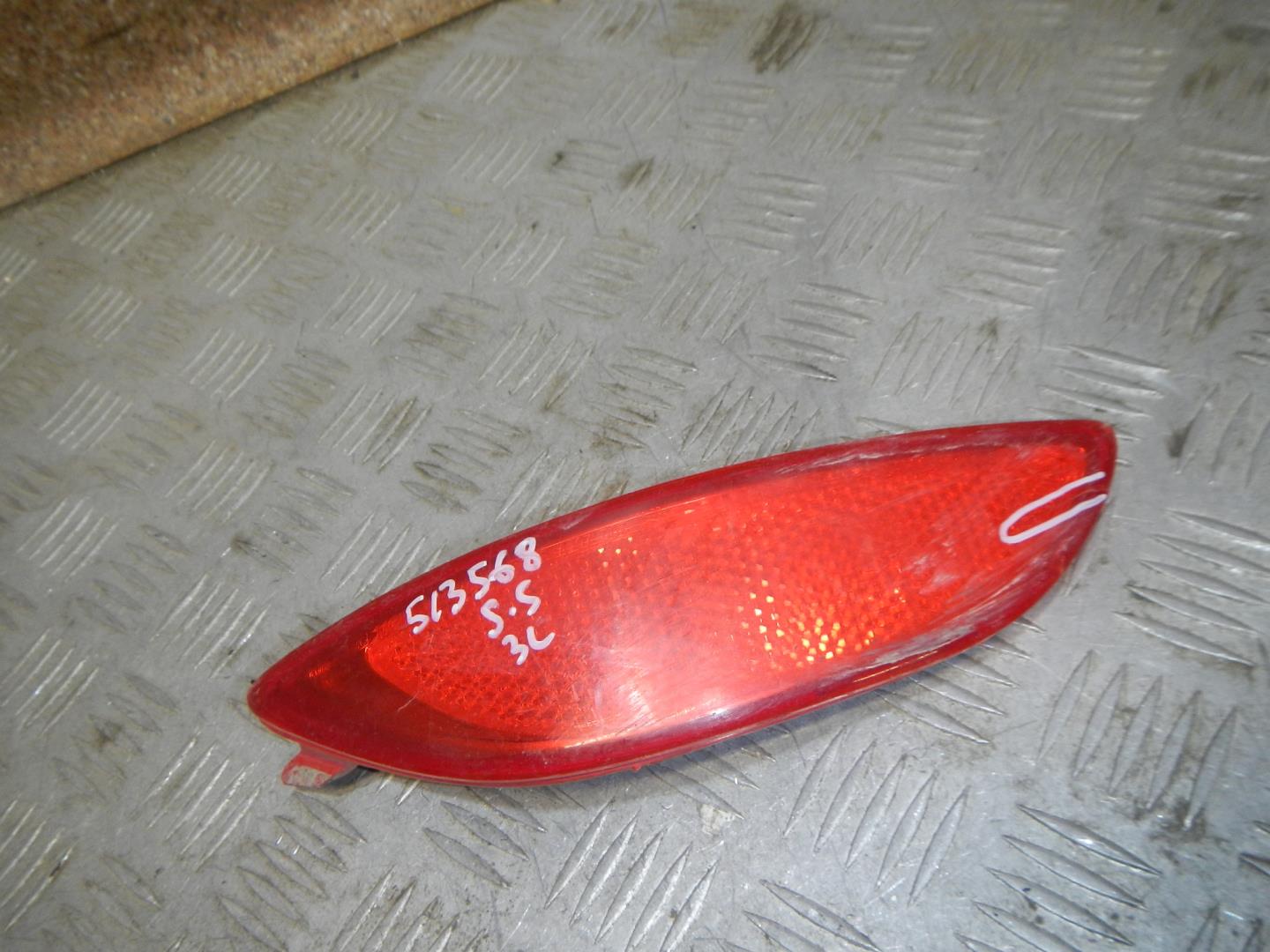 Отражатель в бампер задний левый