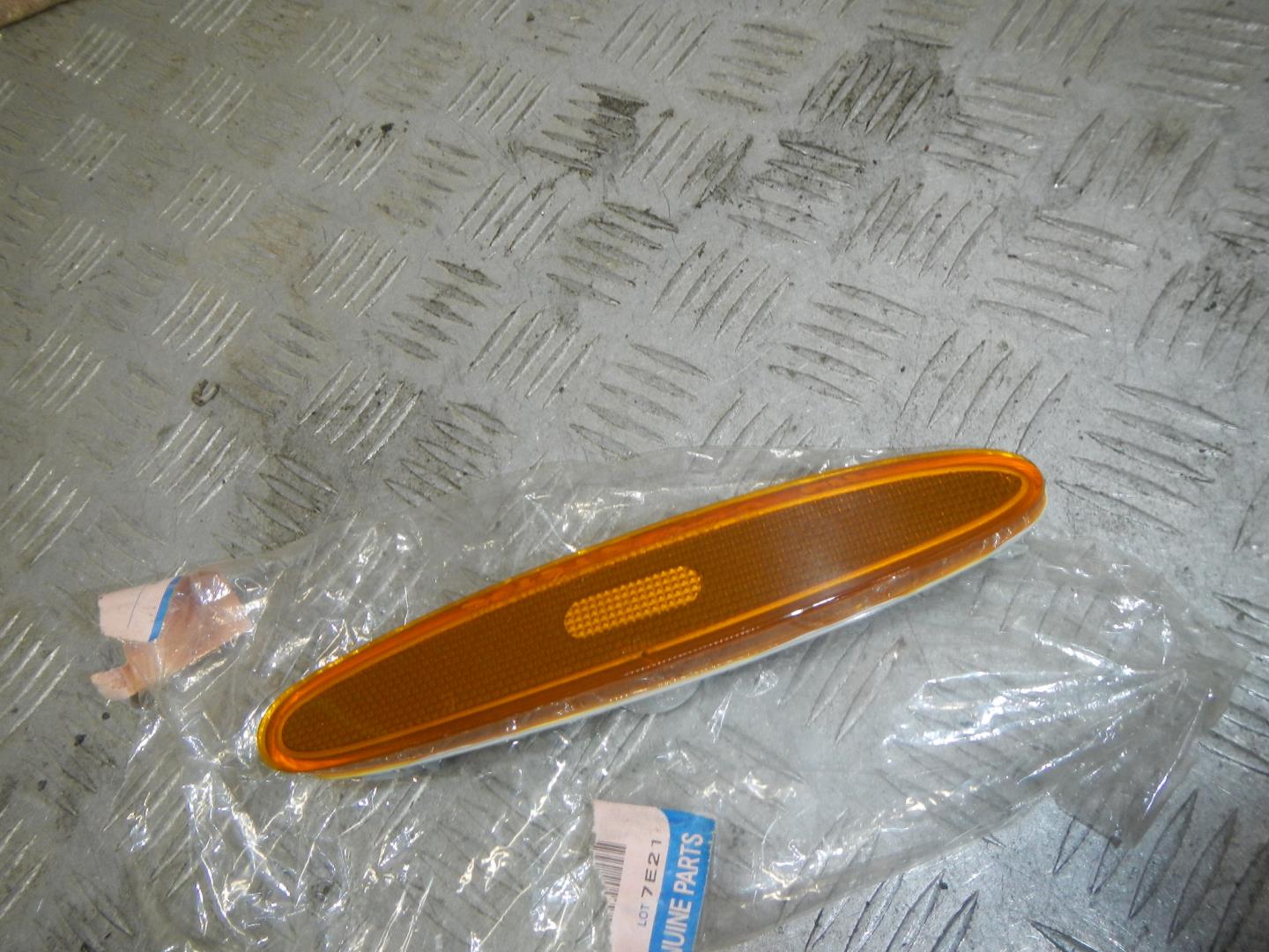 Отражатель в бампер задний левый