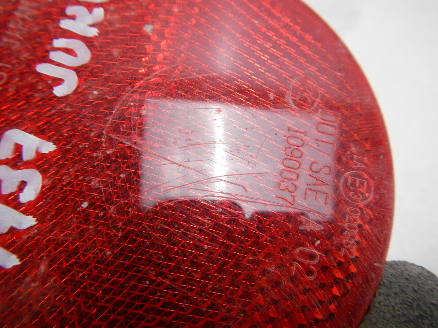 Отражатель в бампер задний левый