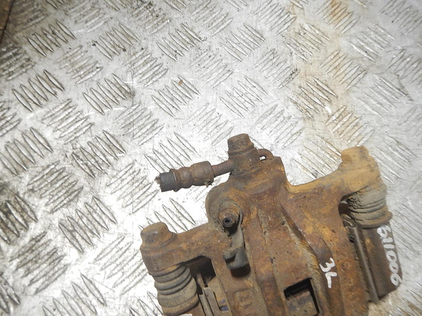 Суппорт задний левый