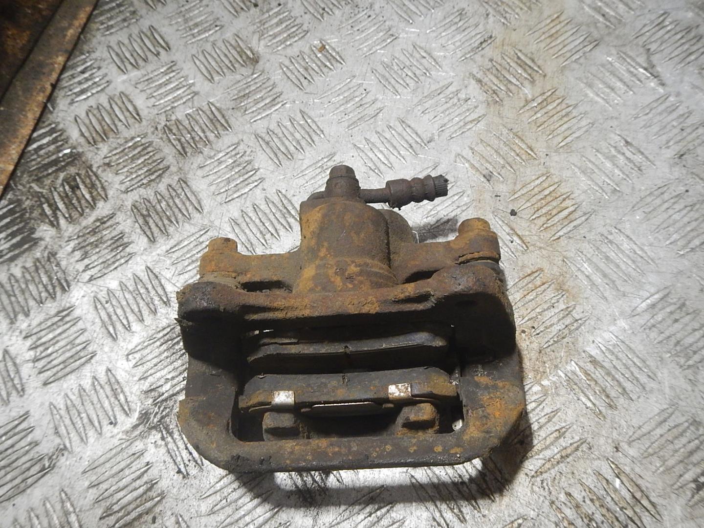 Суппорт задний левый