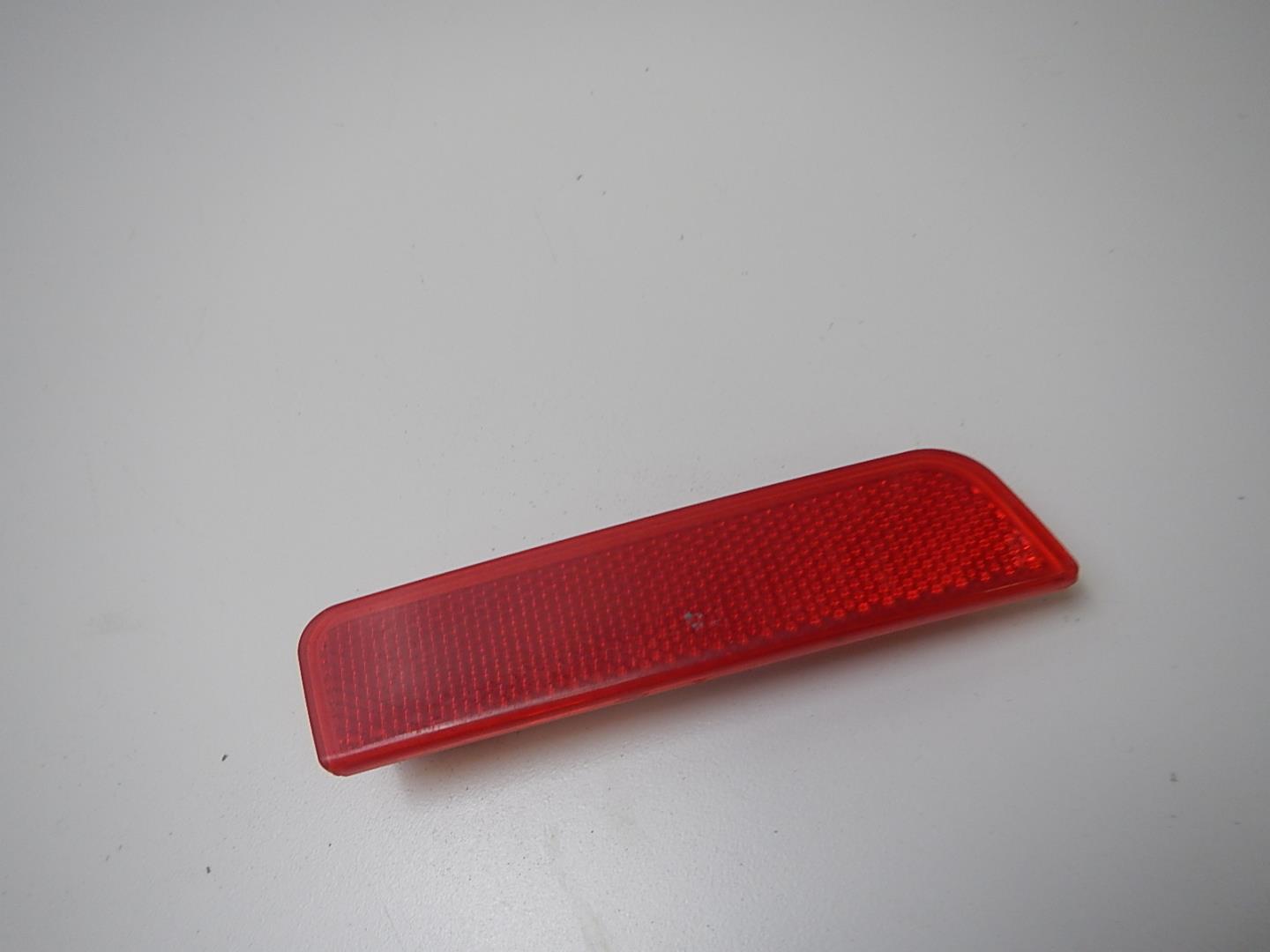 Отражатель в бампер задний левый