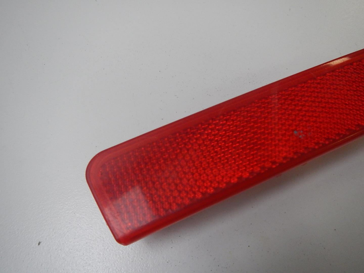 Отражатель в бампер задний левый