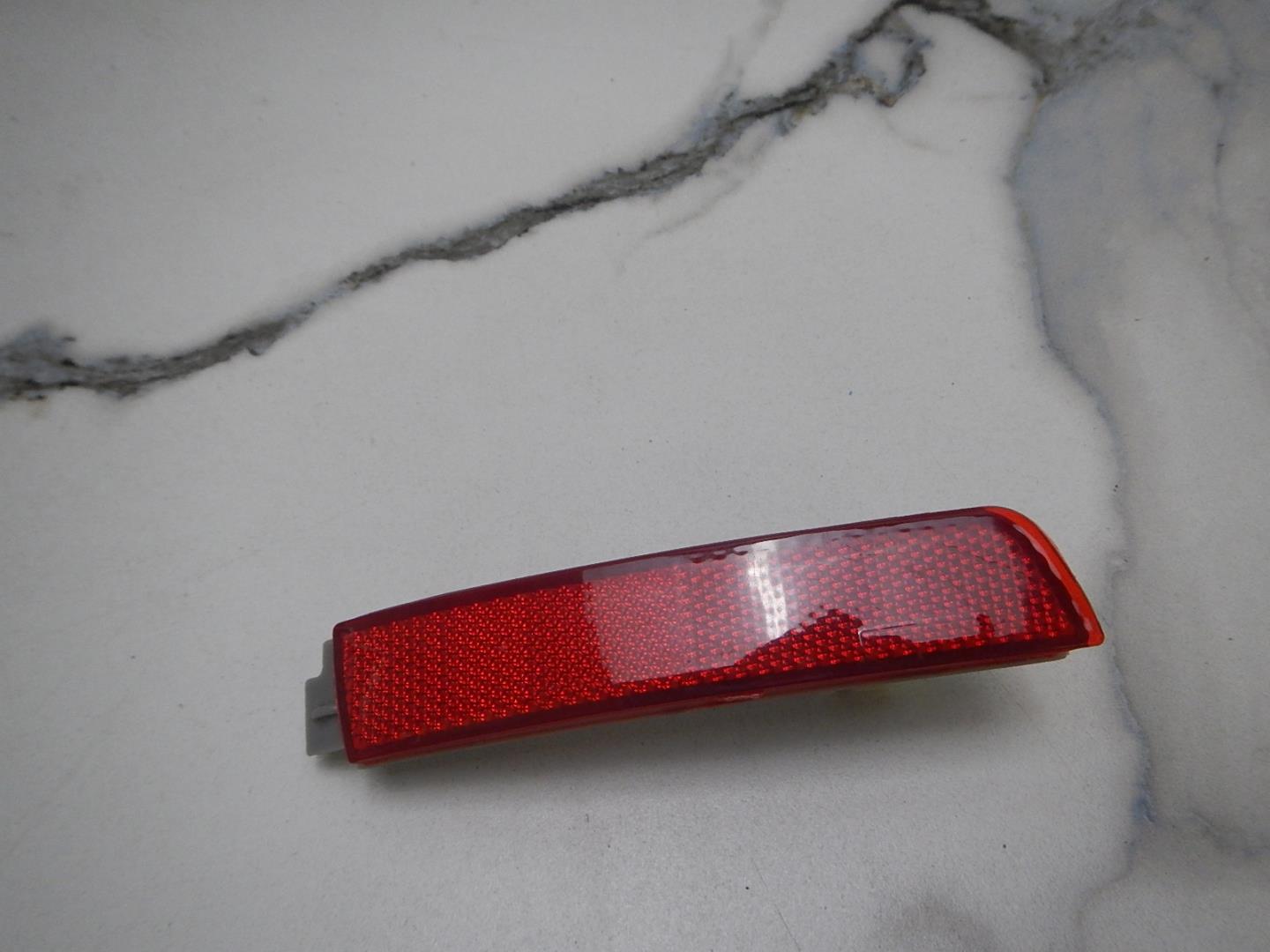 Отражатель в бампер задний левый