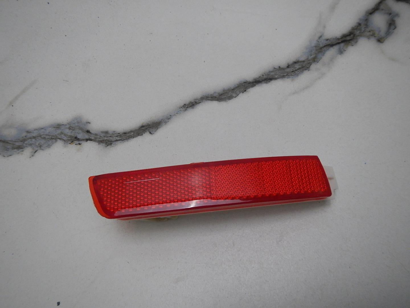 Отражатель в бампер задний левый