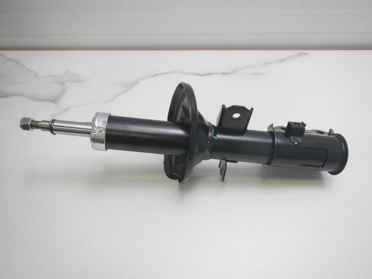 Амортизатор передний левый