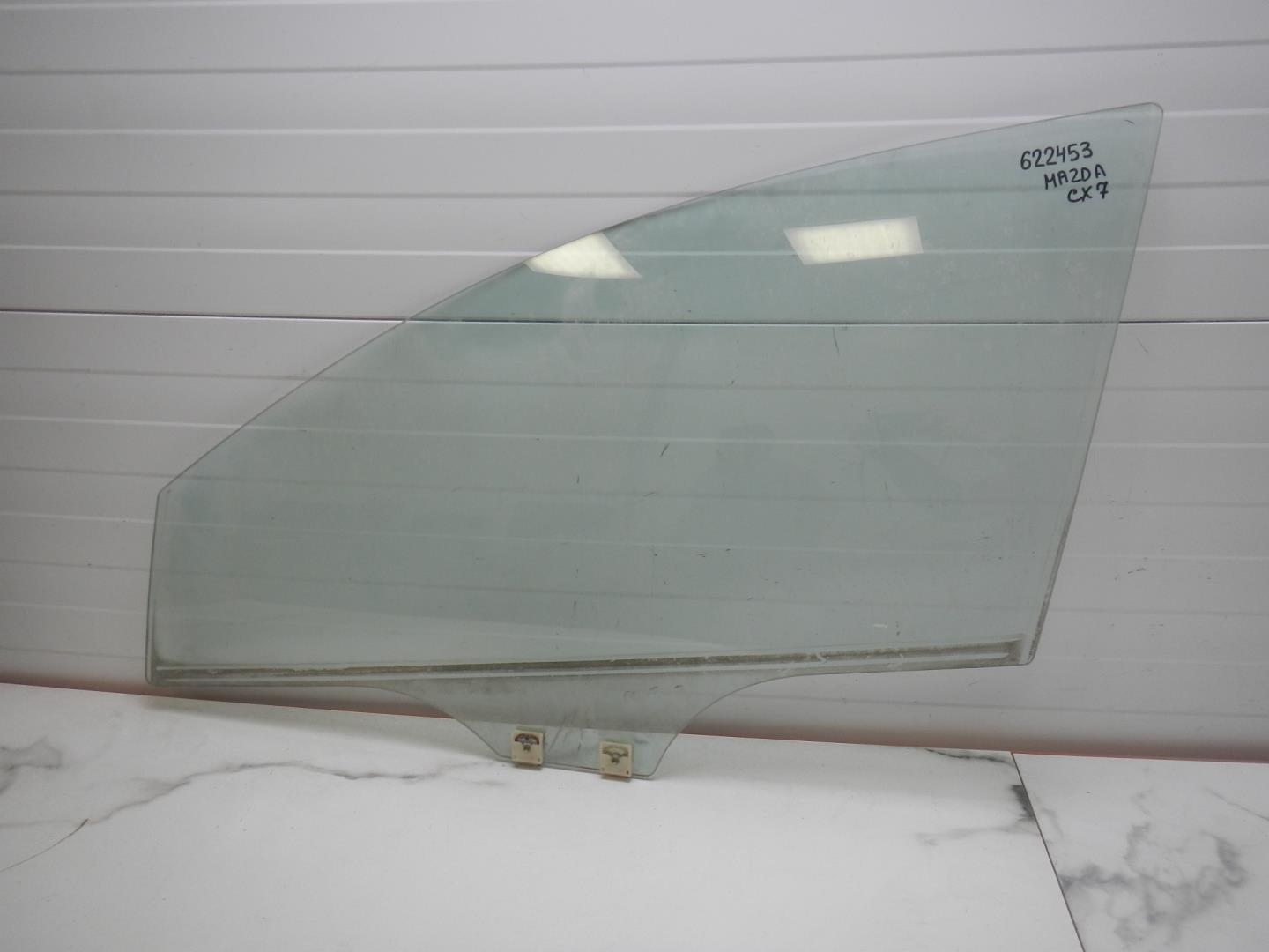 Стекло двери передней левой