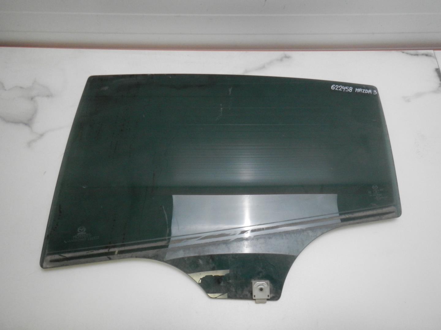 Стекло двери задней левой