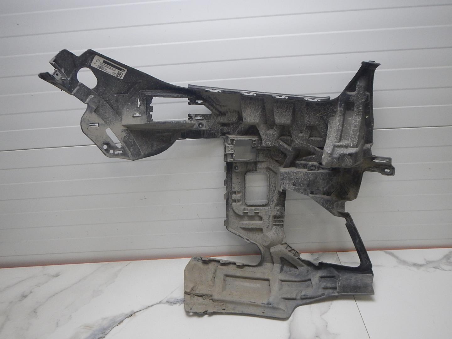 Кронштейн переднего бампера левый