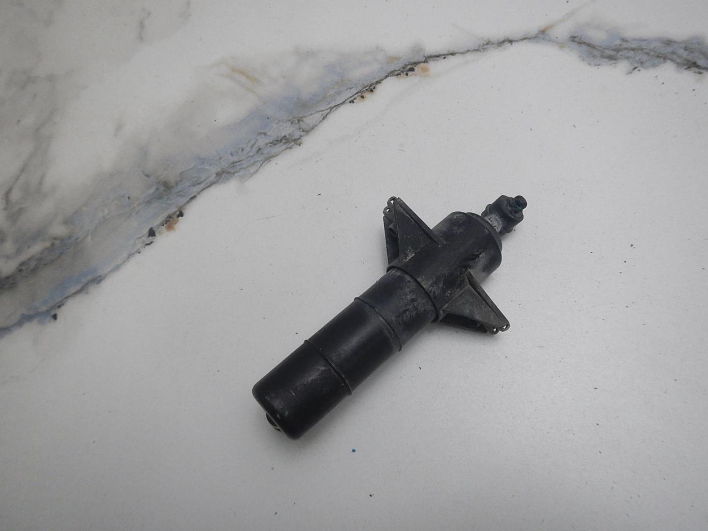 Форсунка омывателя фары