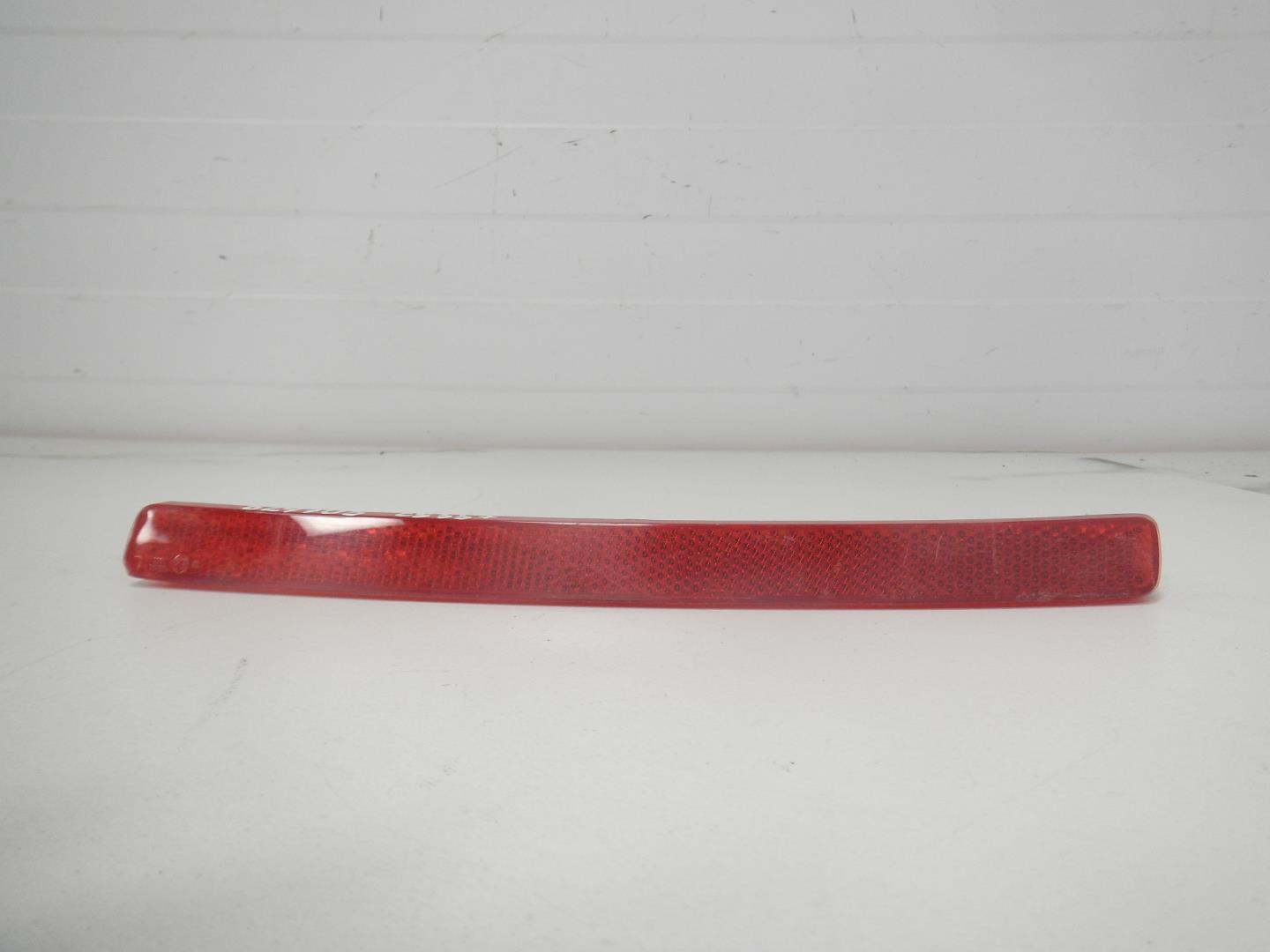 Отражатель в бампер задний левый