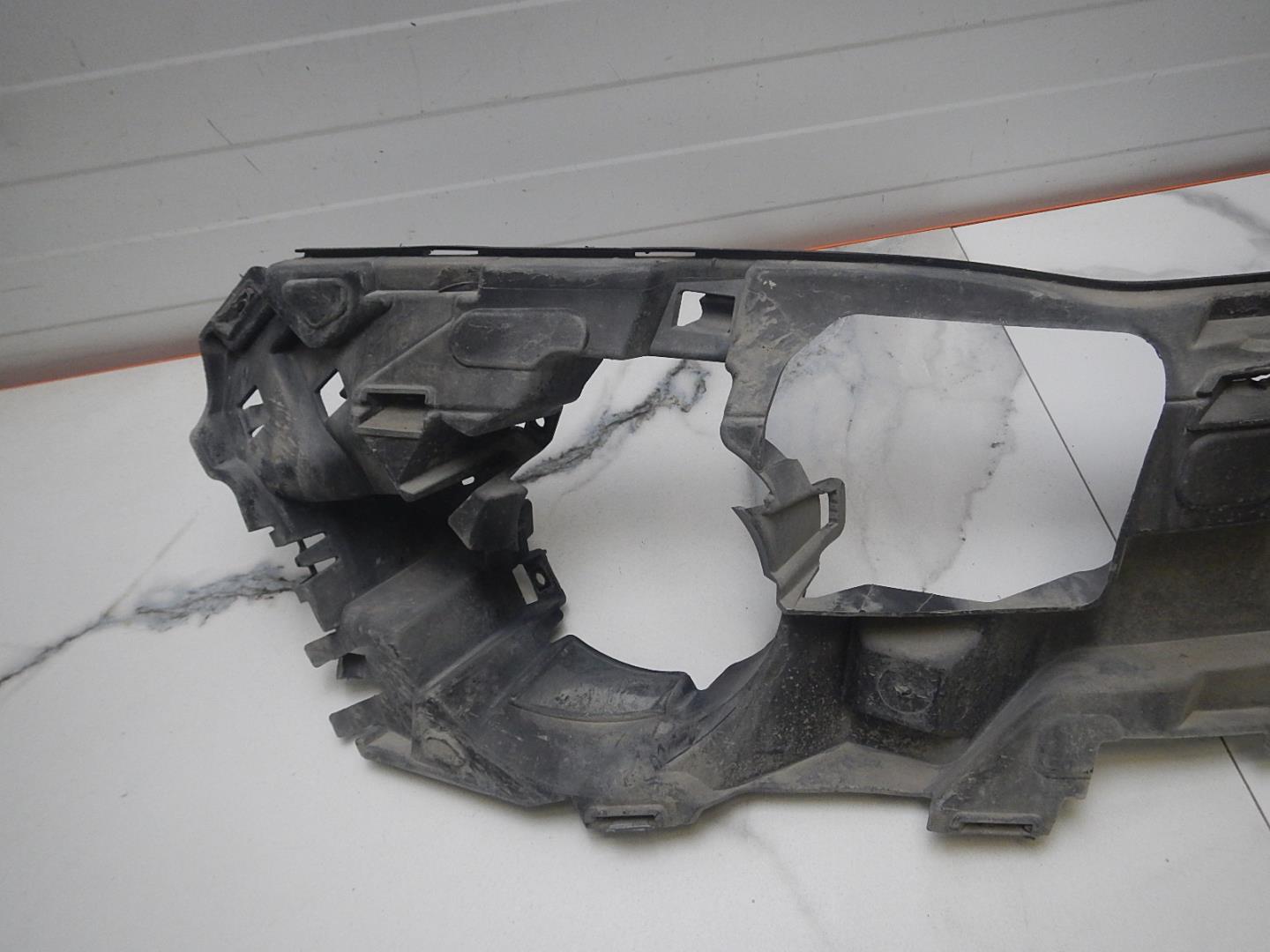 Кронштейн переднего бампера левый