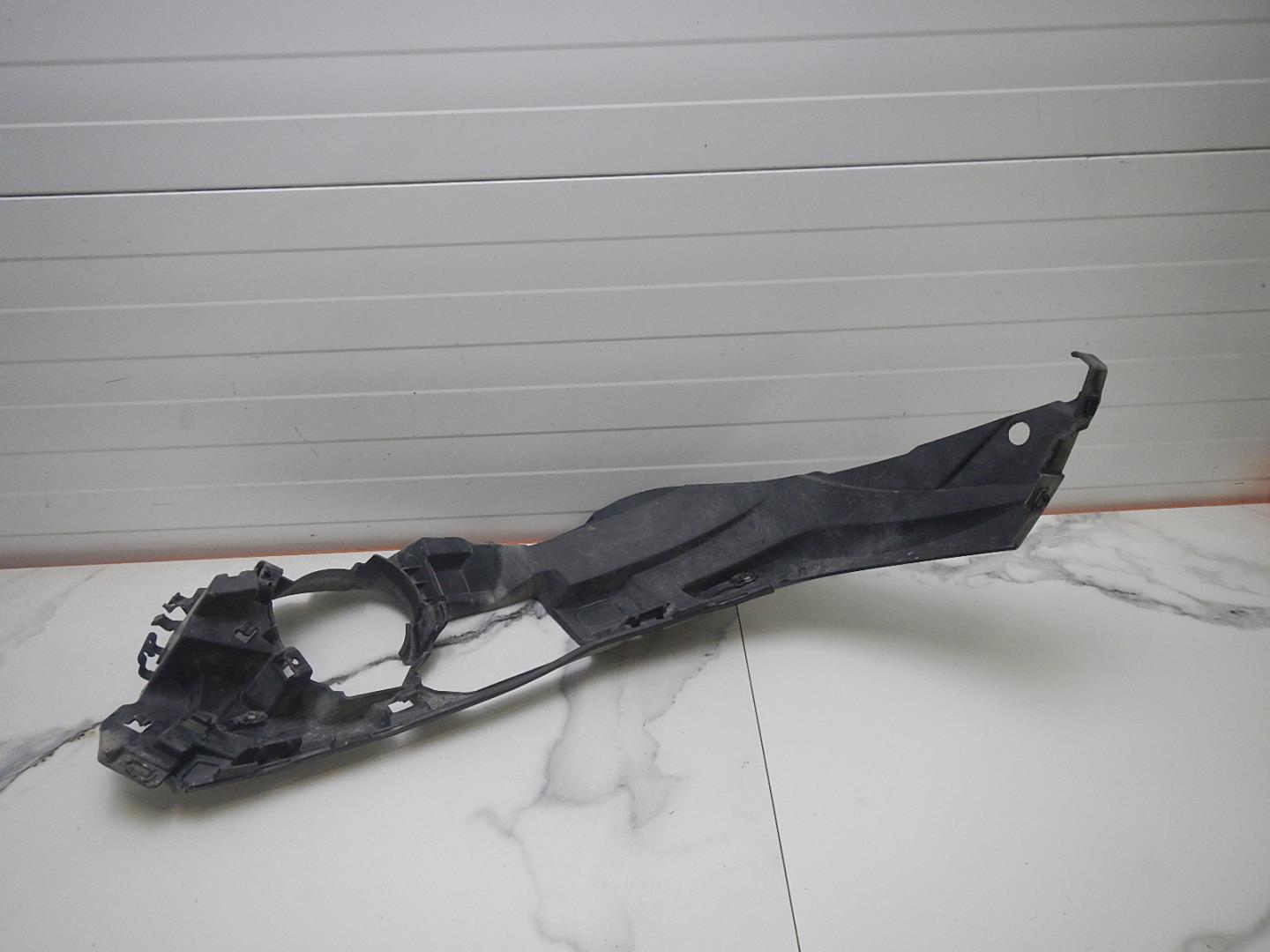 Кронштейн переднего бампера левый