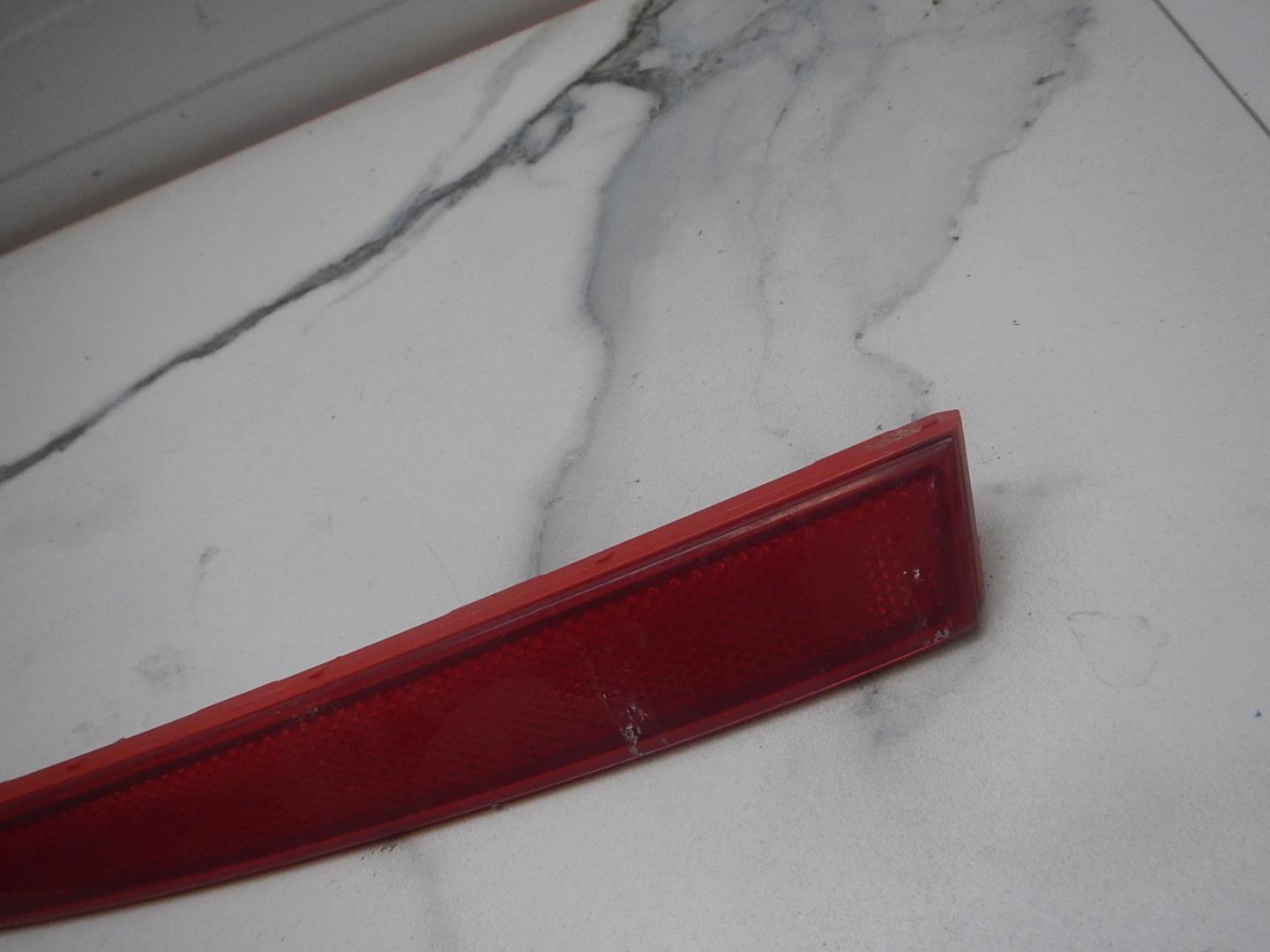 Отражатель в бампер задний левый