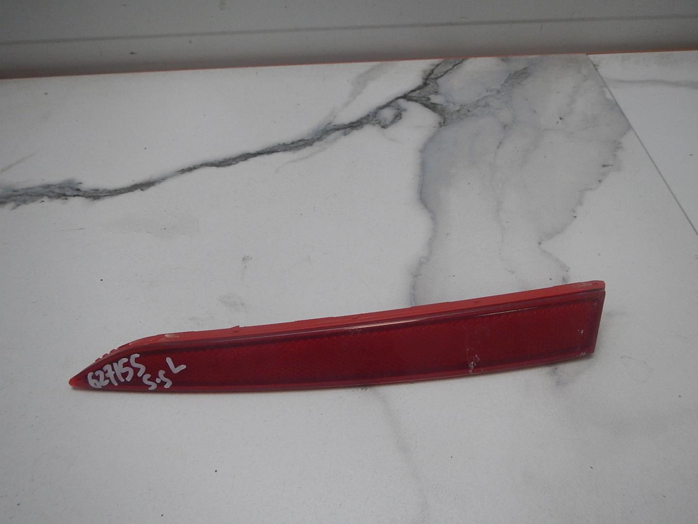 Отражатель в бампер задний левый