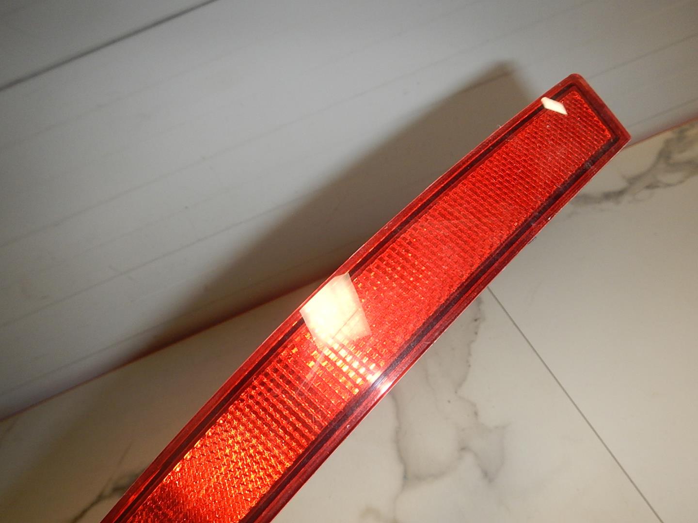 Отражатель в бампер задний левый