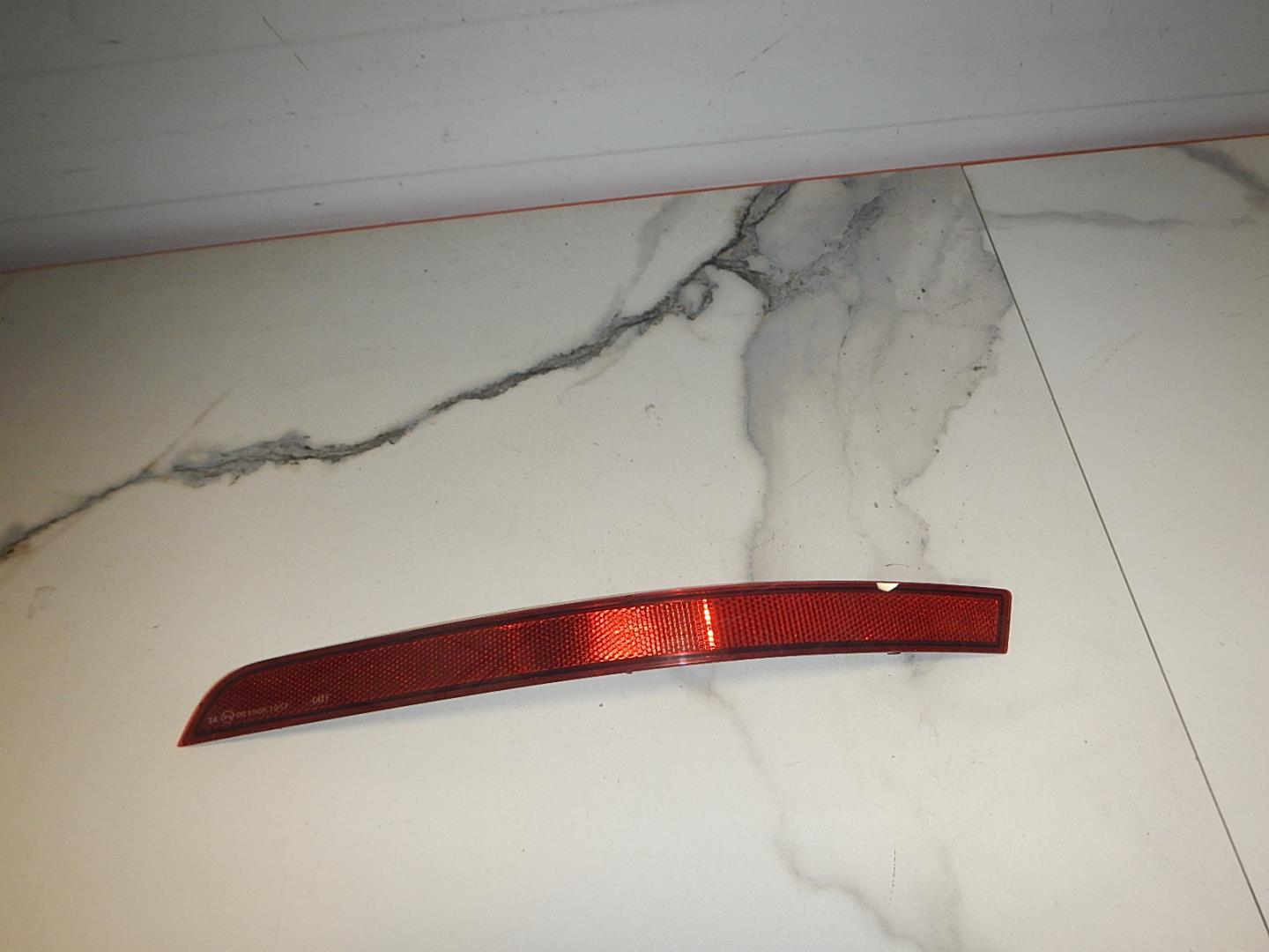 Отражатель в бампер задний левый