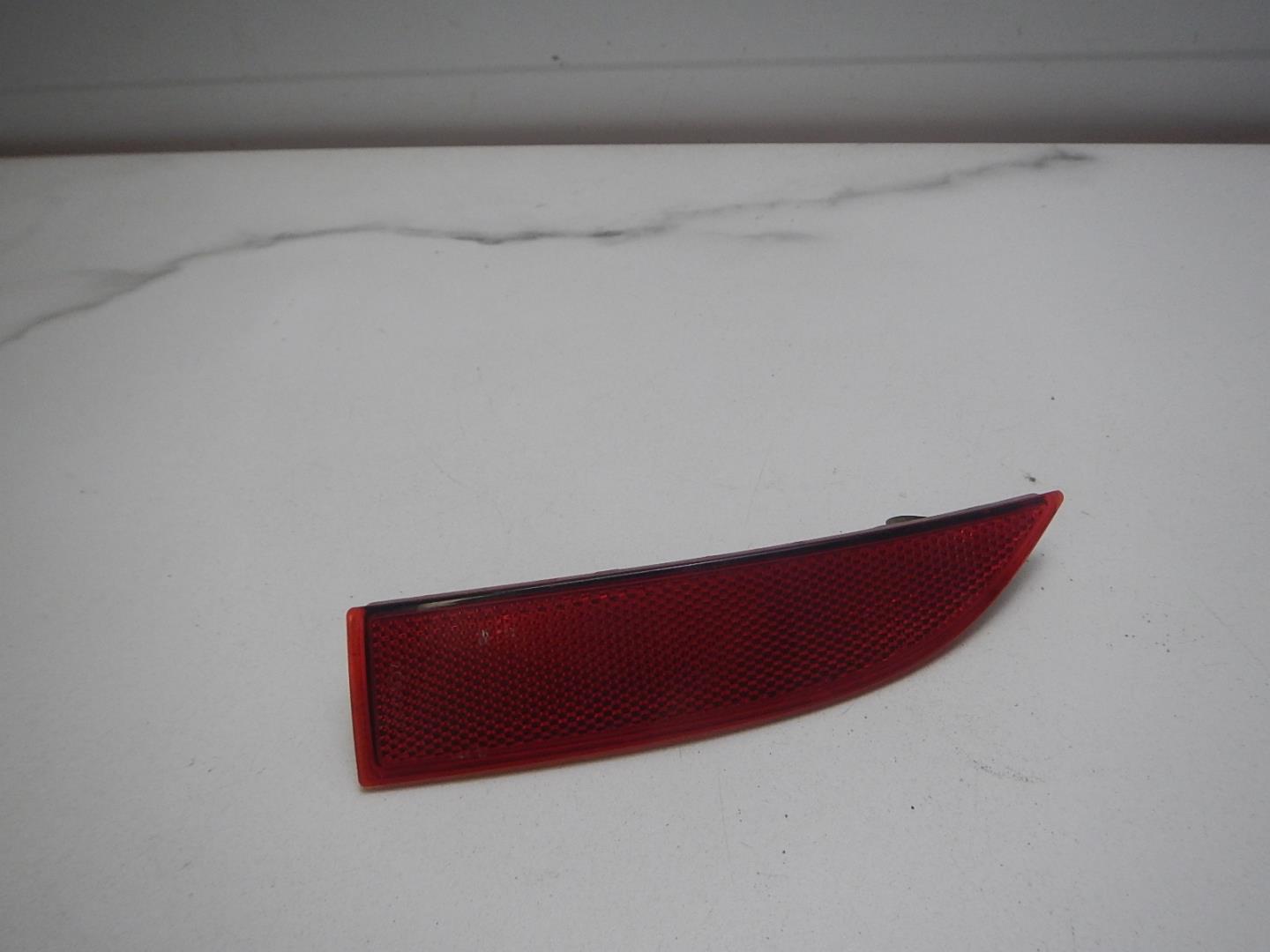 Отражатель в бампер задний левый