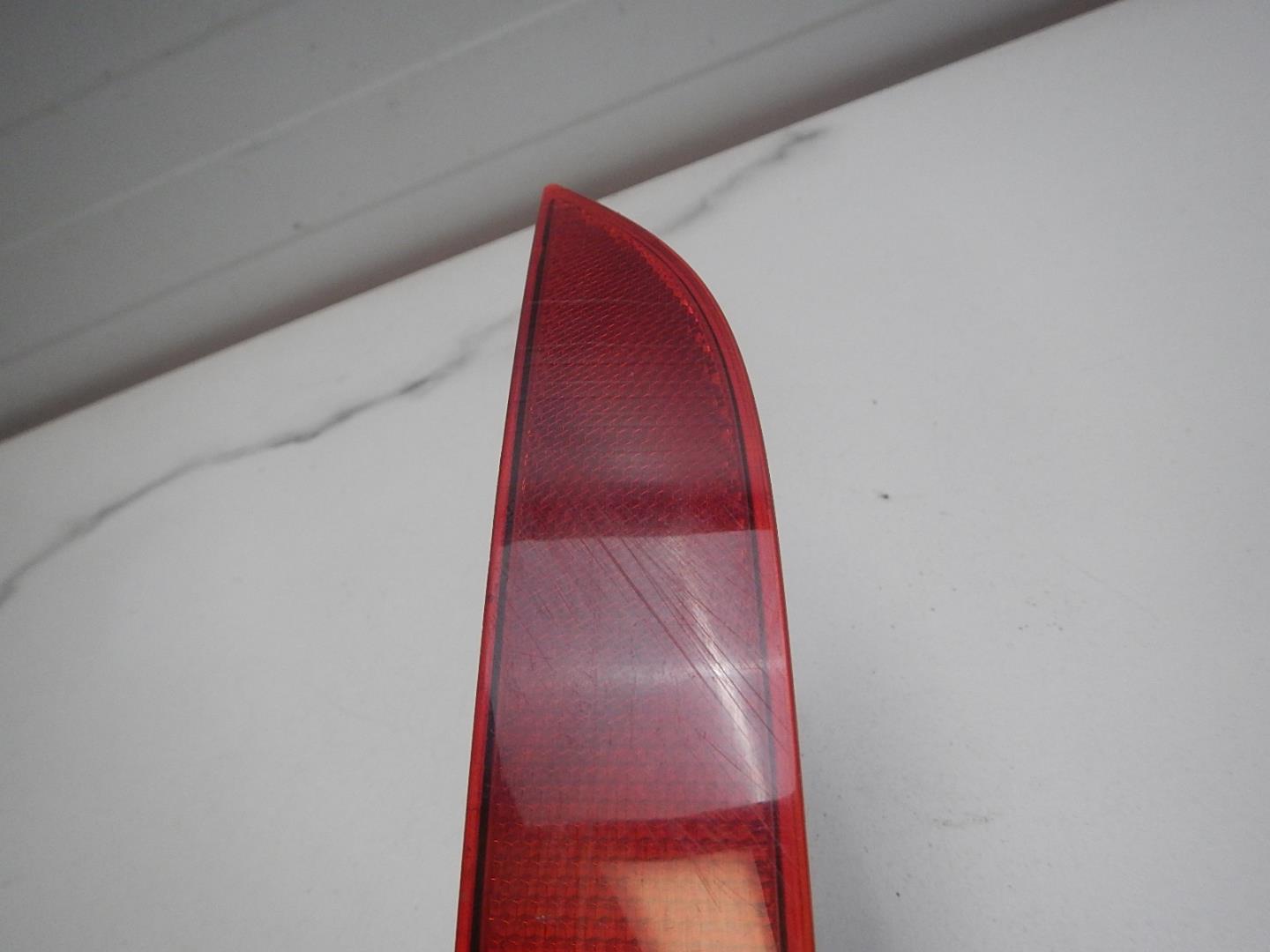 Отражатель в бампер задний левый