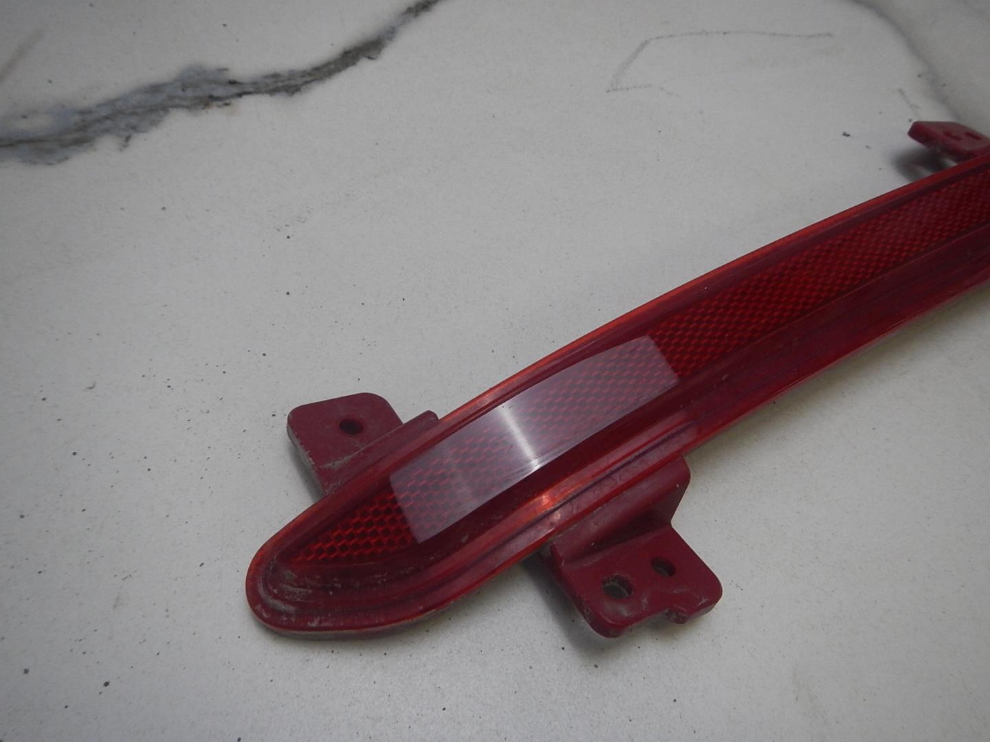 Отражатель в бампер задний левый