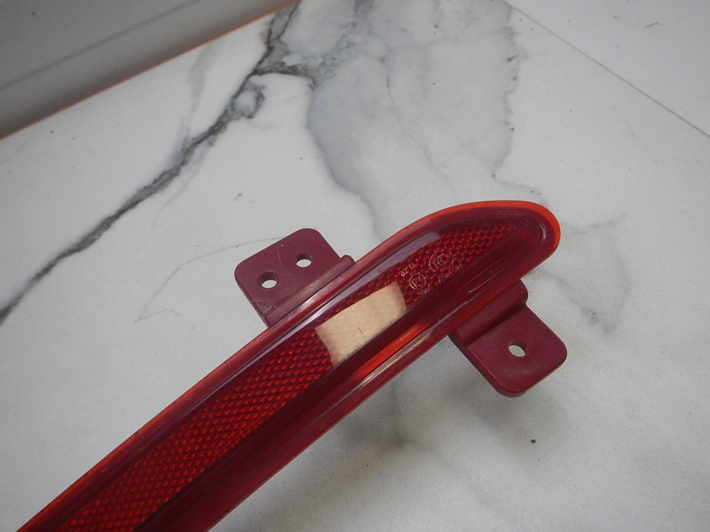 Отражатель в бампер задний левый