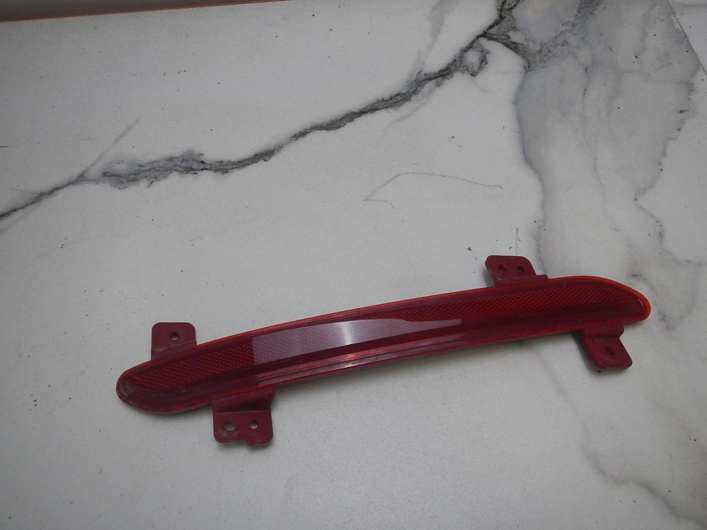 Отражатель в бампер задний левый