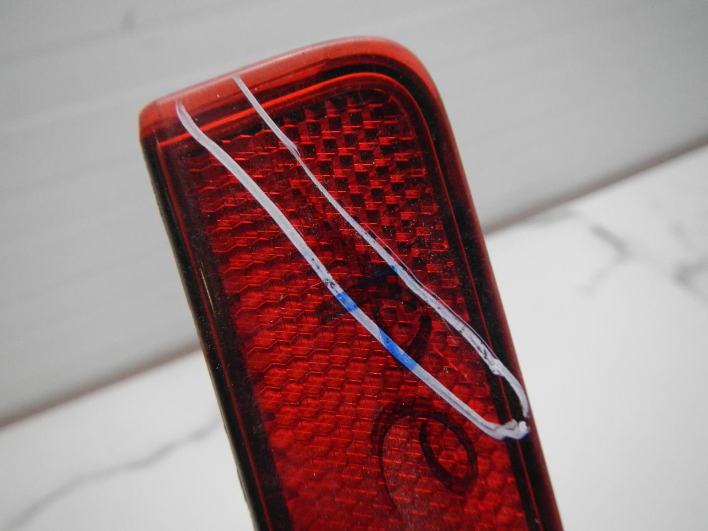 Отражатель в бампер задний левый