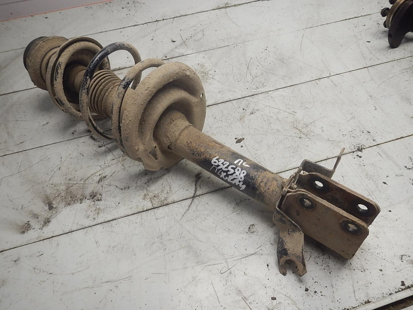 Амортизатор передний левый