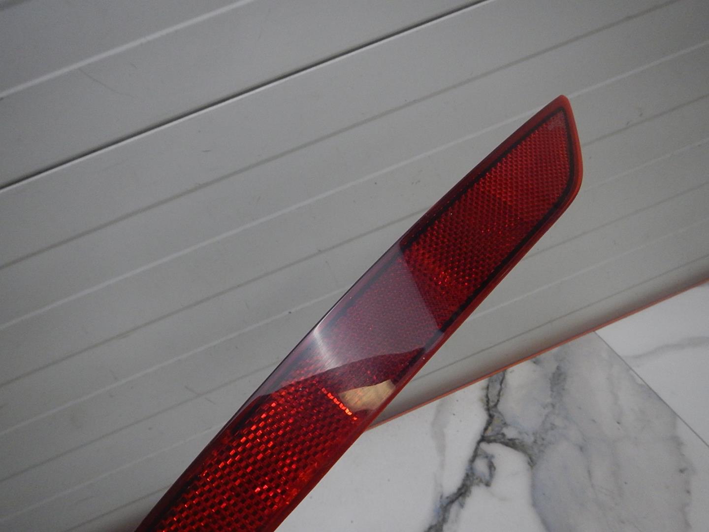 Отражатель в бампер задний левый