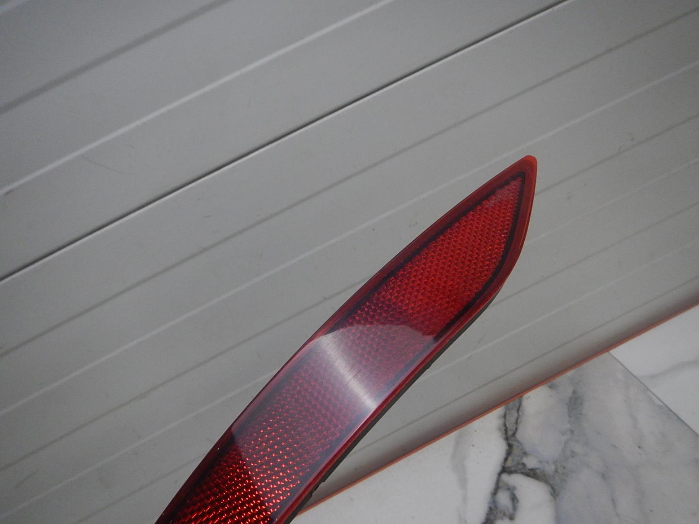 Отражатель в бампер задний левый