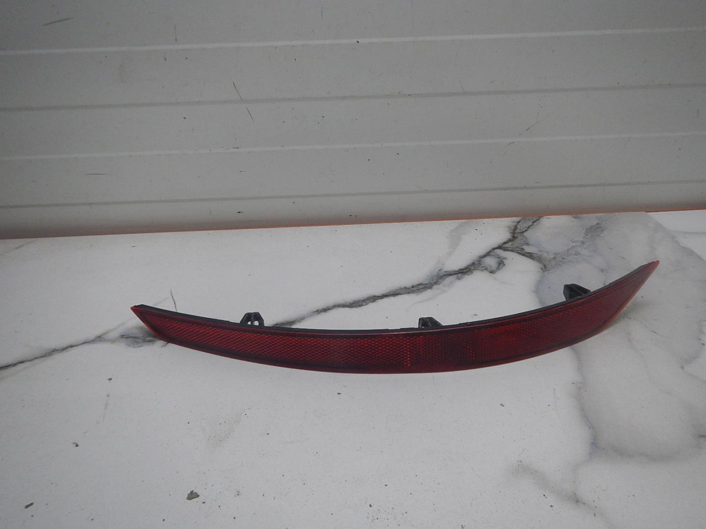 Отражатель в бампер задний левый