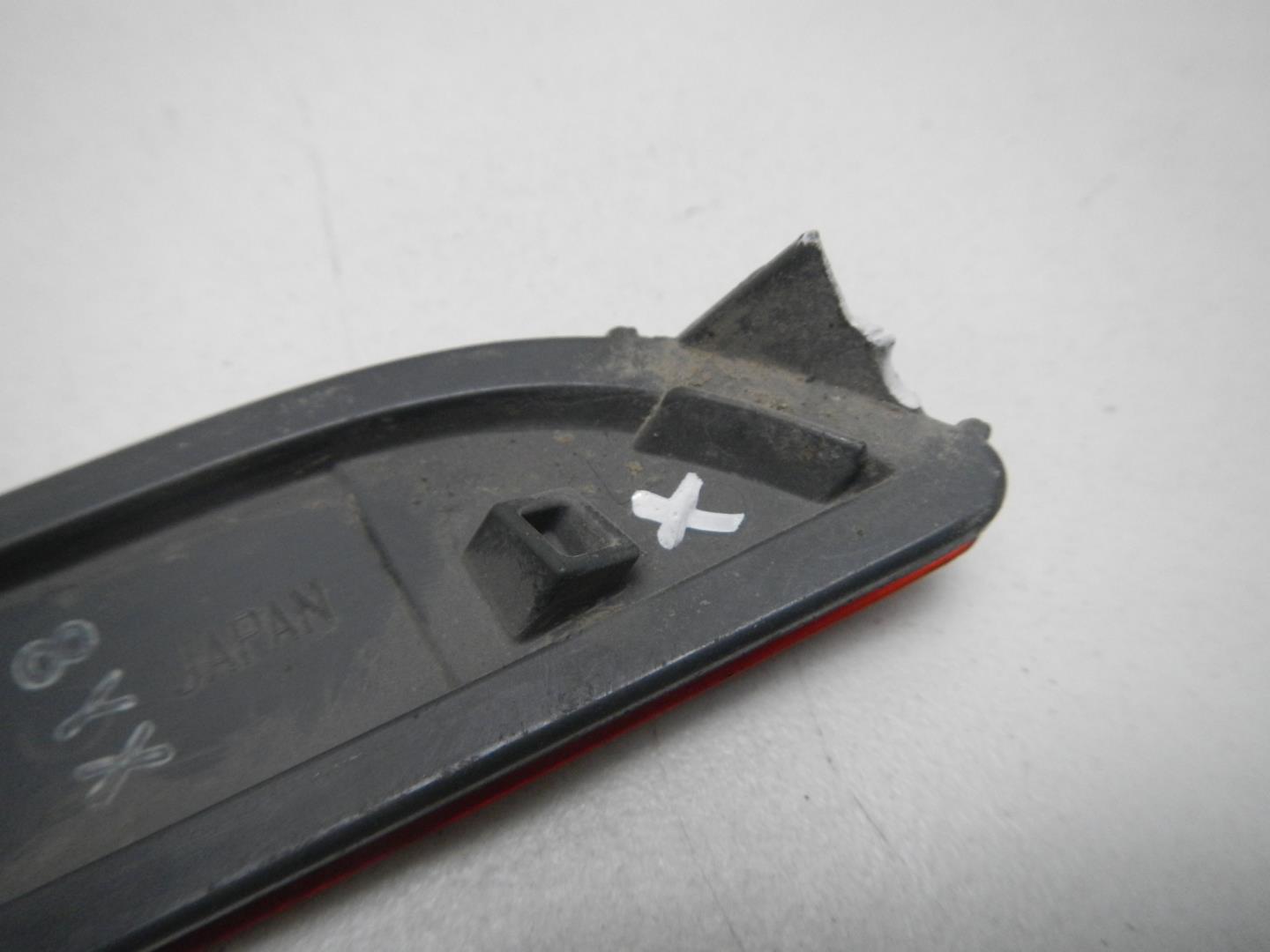 Отражатель в бампер задний левый