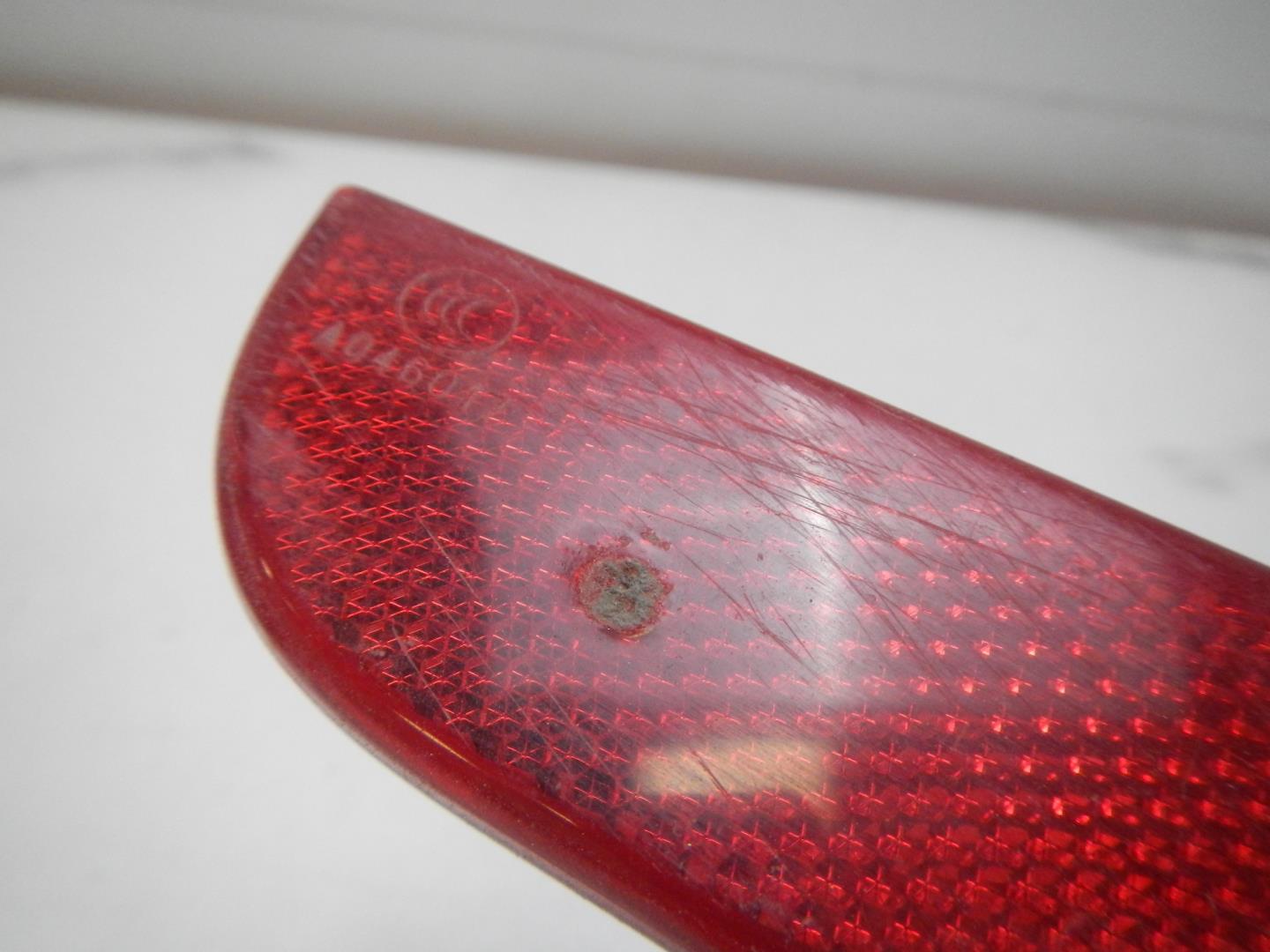 Отражатель в бампер задний левый