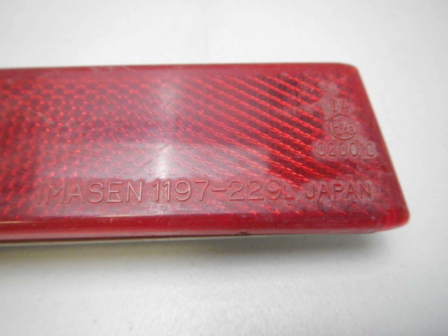 Отражатель в бампер задний левый