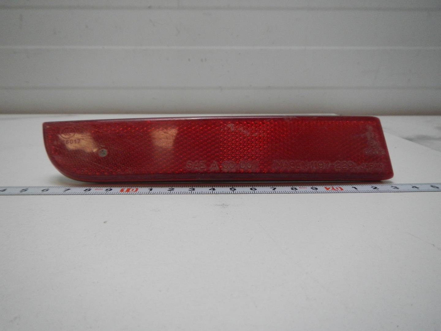 Отражатель в бампер задний левый