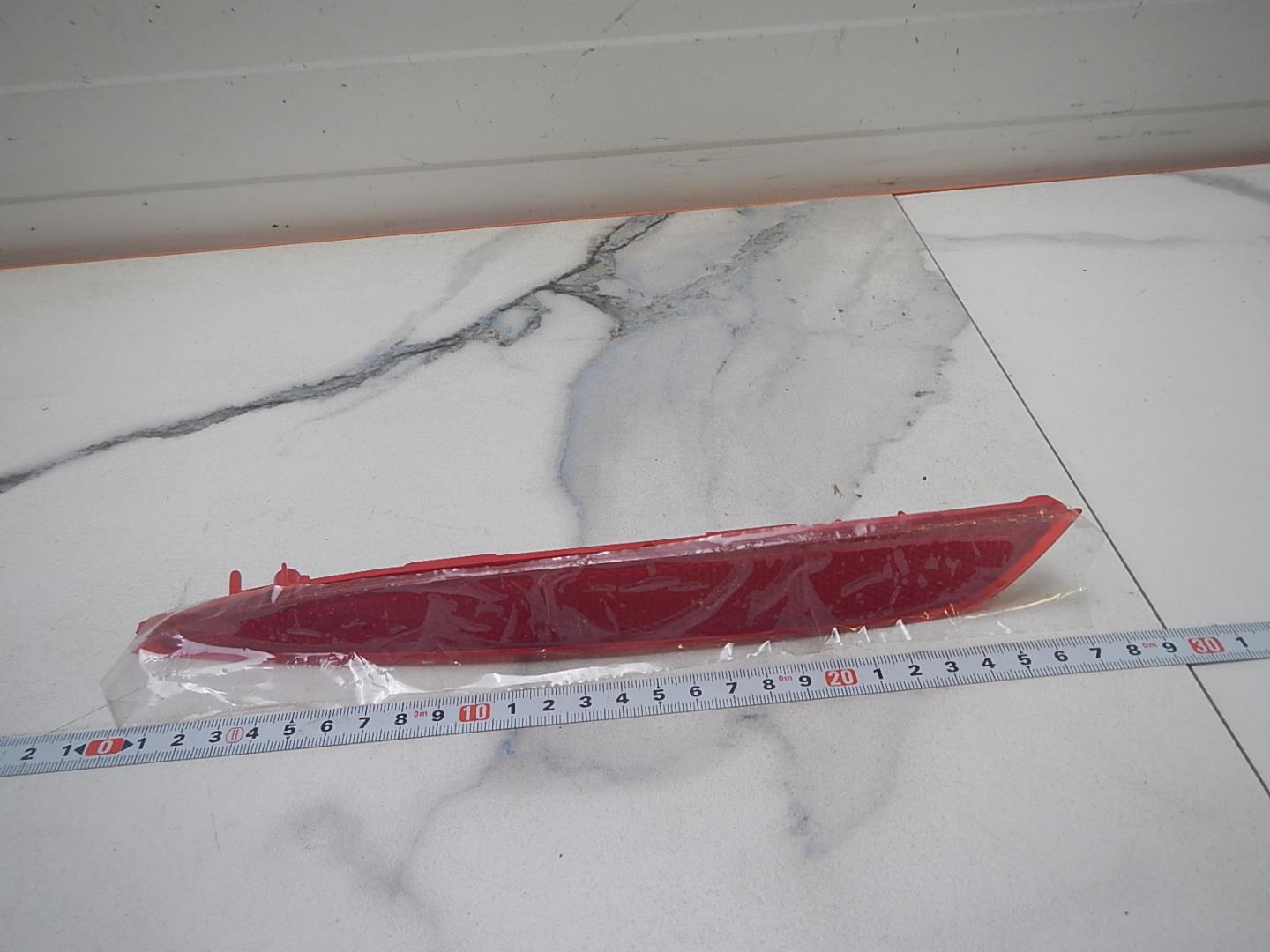 Отражатель в бампер задний левый