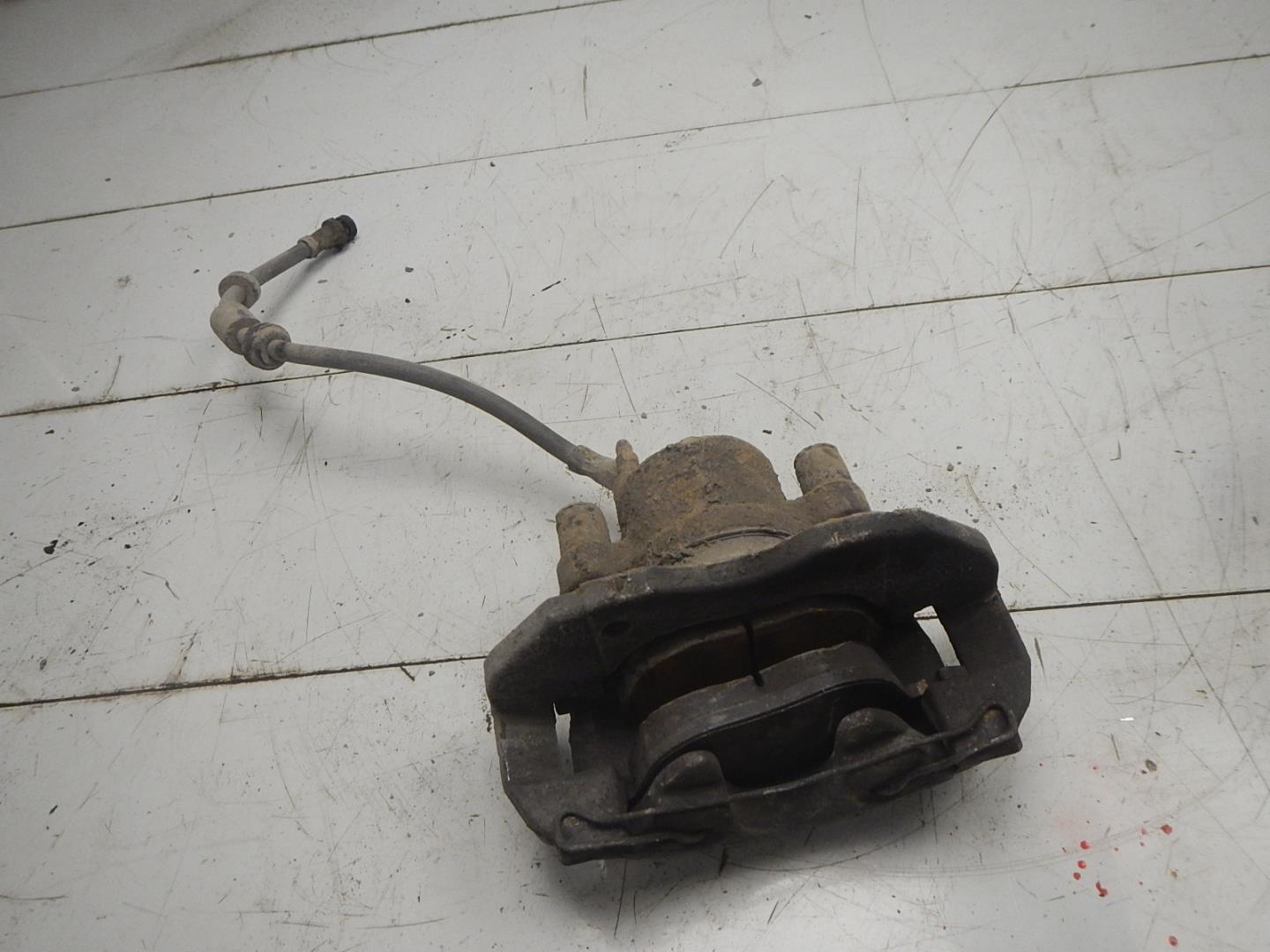 Суппорт передний левый