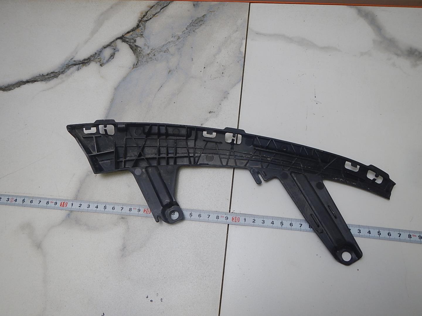 Кронштейн фар левый