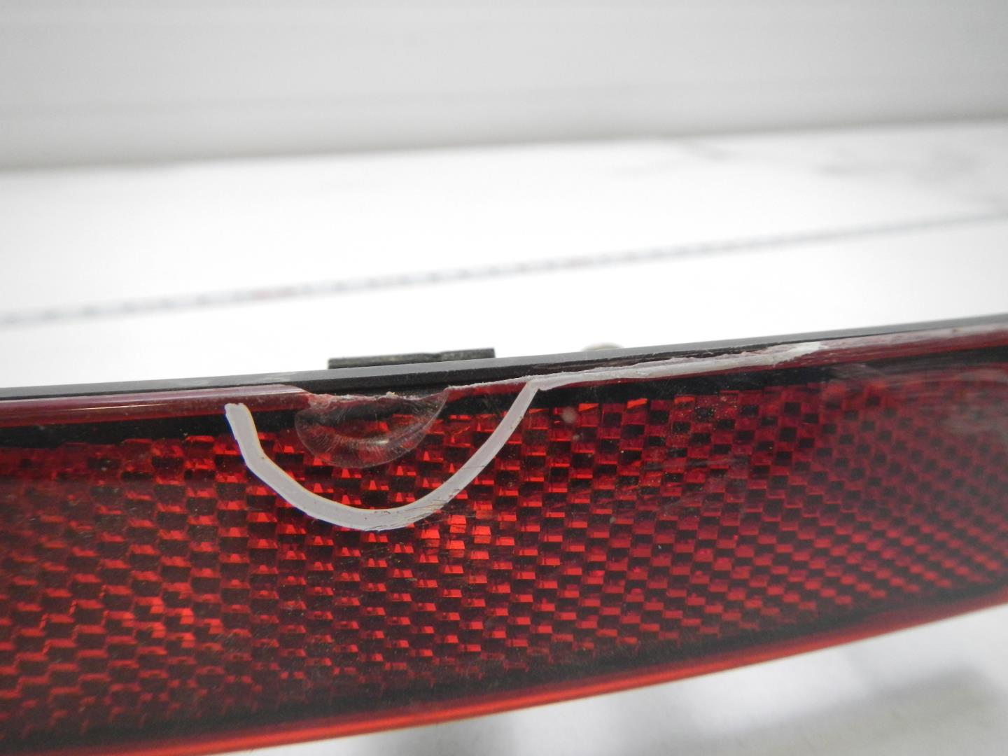 Отражатель в бампер задний левый