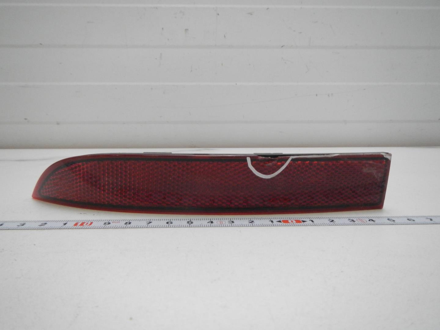 Отражатель в бампер задний левый