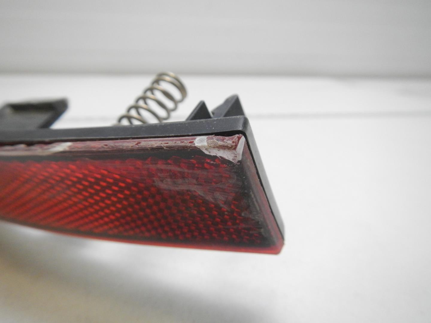 Отражатель в бампер задний левый