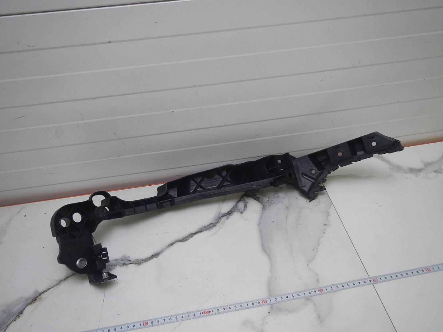 Кронштейн фар левый